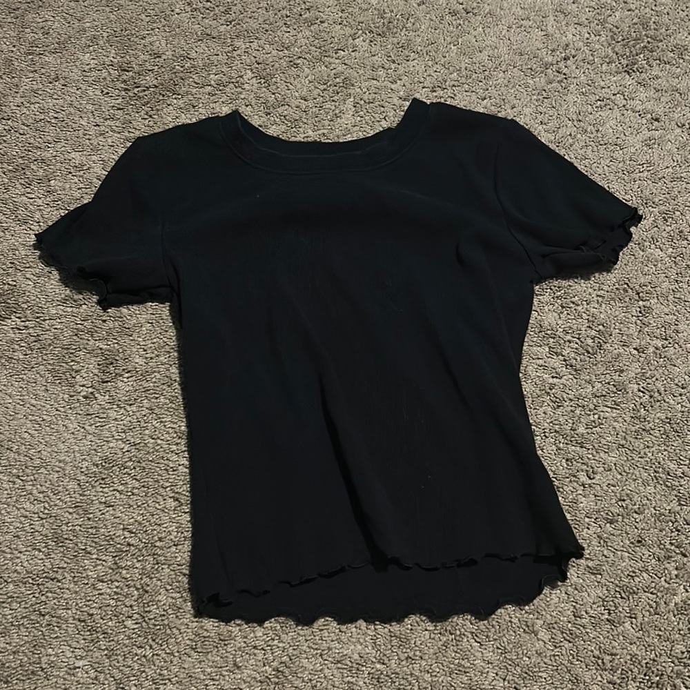 Black top with ruffles on sleeves